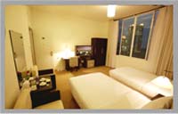 Executive twin with city view, king bed, private facilities, and breakfast